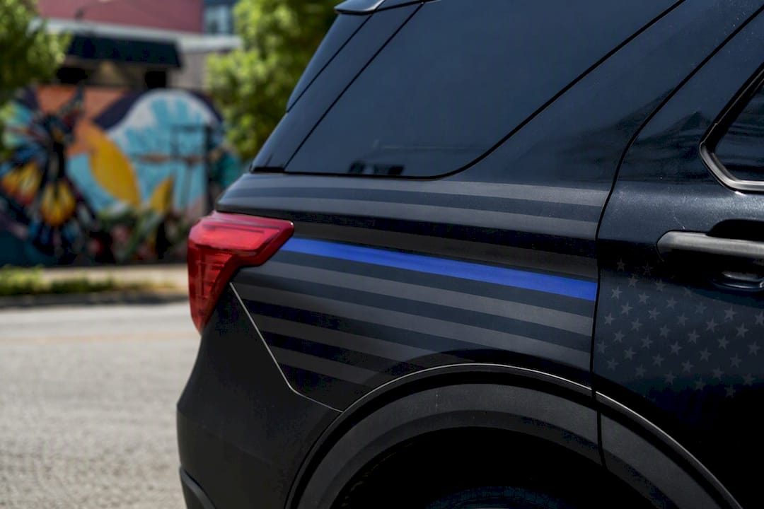 Partial thin blue line decal on police patrol vehicle