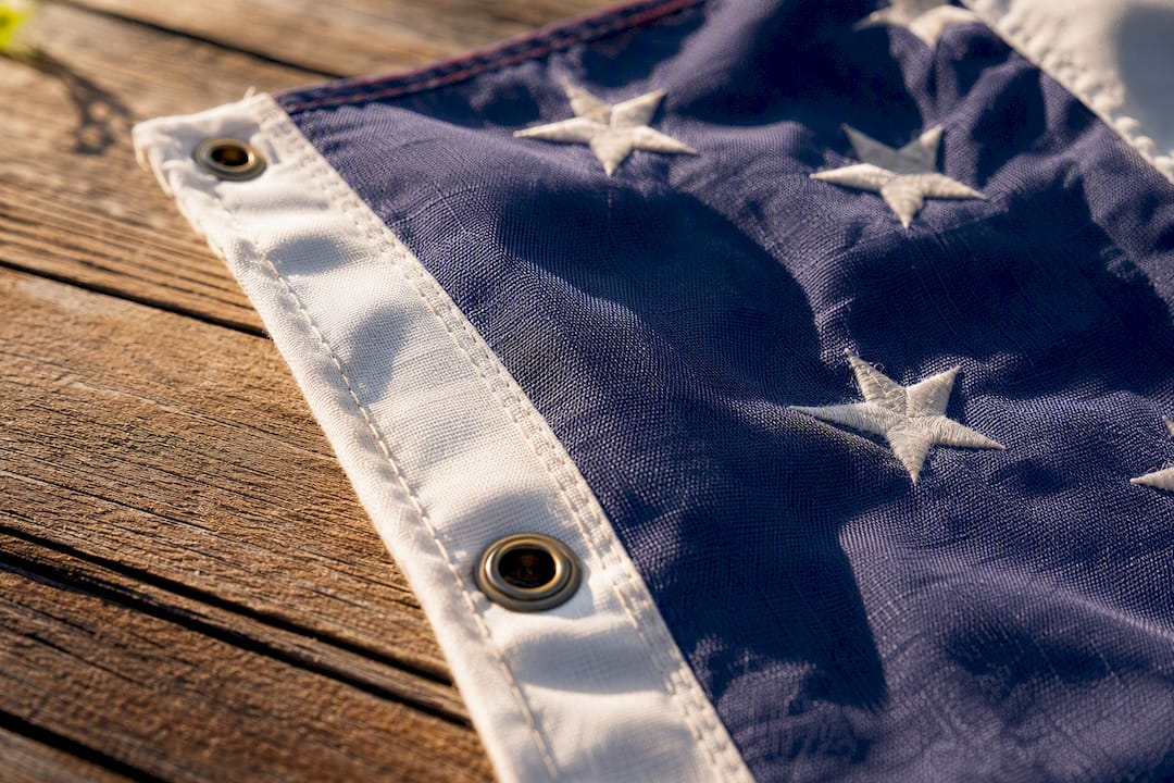 Close-up of flag fabric and pole sleeve hardware