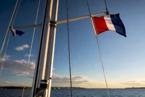 Boat mast showing courtesy flag placement