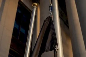 Partial POW/MIA flag beside ceremonial pole