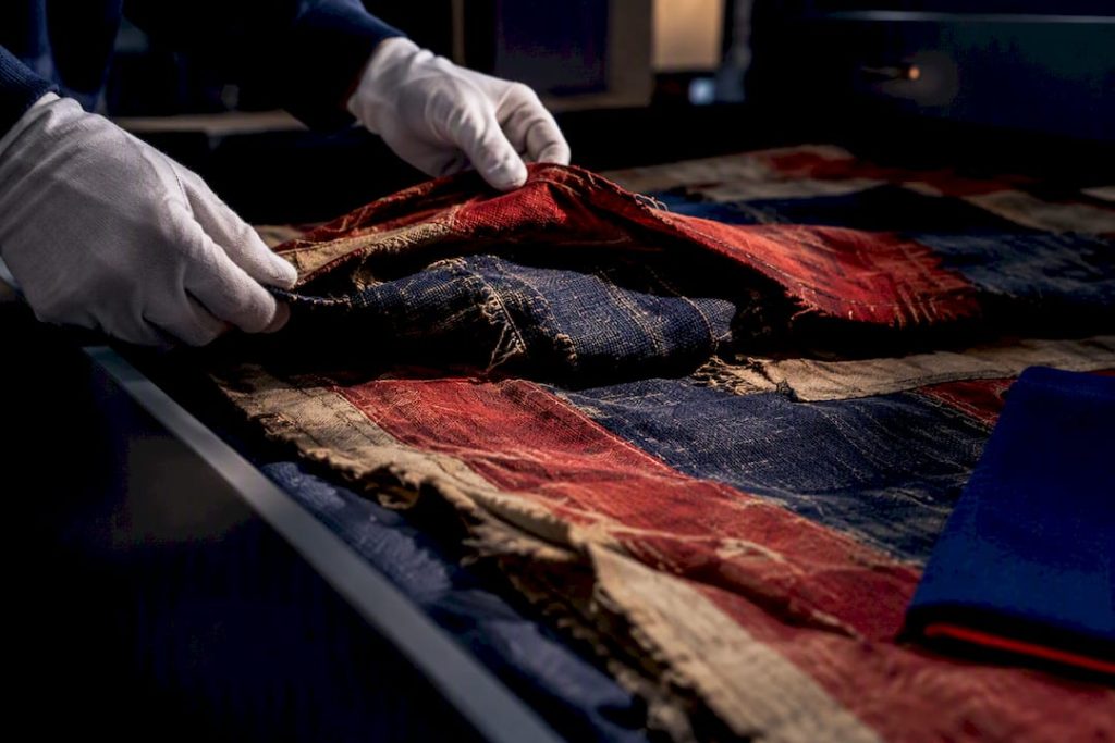 Partially folded Civil War flag textiles in archive