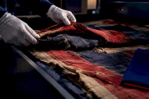 Partially folded Civil War flag textiles in archive