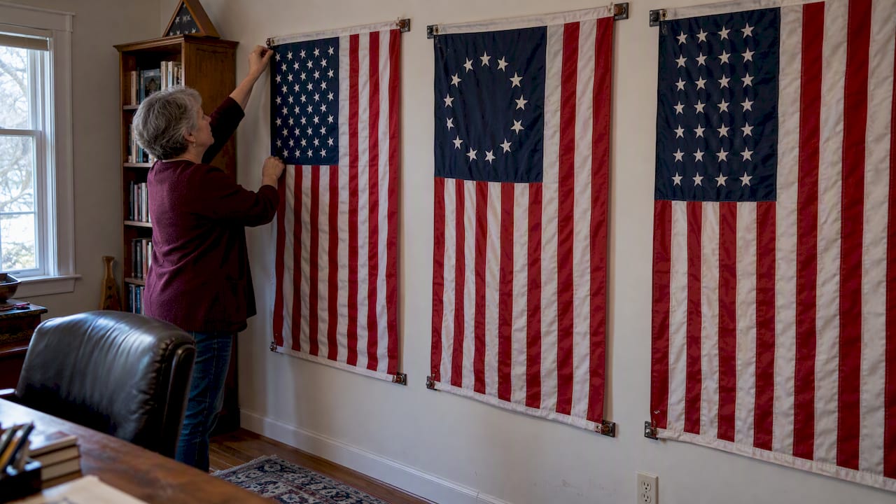 Collector displaying modern and historical American flags
